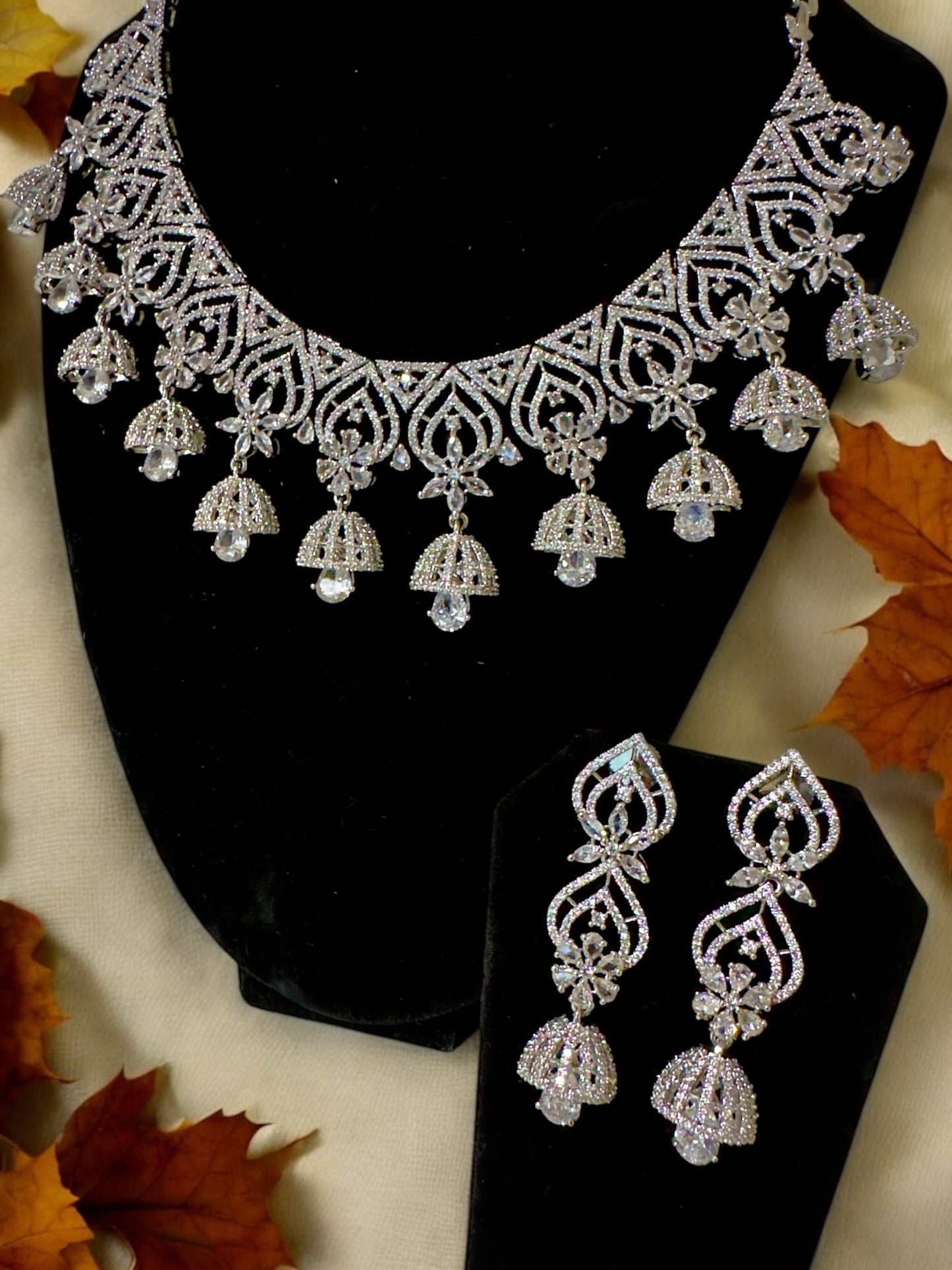 Heartfully designed CZ Neckset with Jhumka Hangings with Green White CZ Flowers